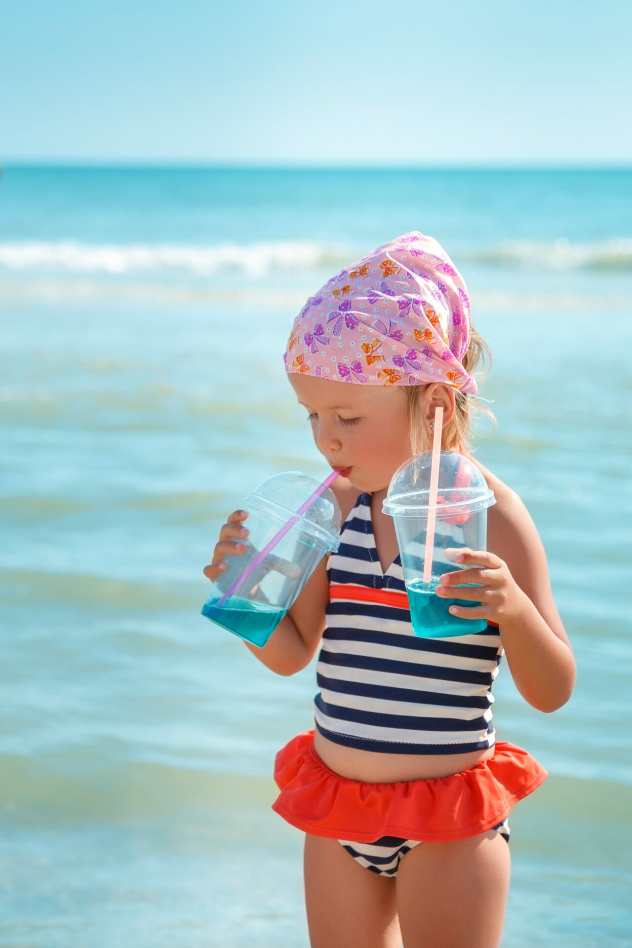 Happy little girl in swimsuit